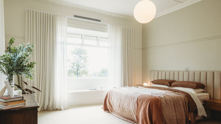Bright Bedroom with neutral furnishings